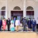 Workers team pose with President Museveni after the meeting ofnthe mid- term of NSSF Funds