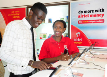 An Airtel Uganda customer care advisor attends to a customer