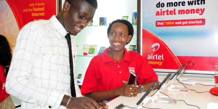 An Airtel Uganda customer care advisor attends to a customer