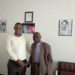 Rogers Bulegeya with Canon Njoji at his office located in Masaka Town.