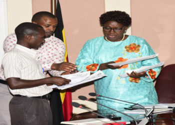Speaker Kadaga (R) receives the petition