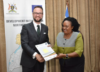 Ms Christine Guwatudde Kintu (Right), the Permanent Secretary at the Office of the Prime Minister (OPM), congratulates Mr Mathias Kamp, the country director of Konrad-Adenauer-Stiftung, one of the grantees shortly after signing the DINU grants contract at the OPM in Kampala on January 14, 2020.