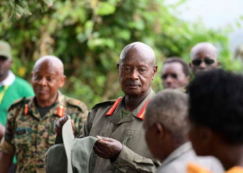 President Museveni talks to locals during a break