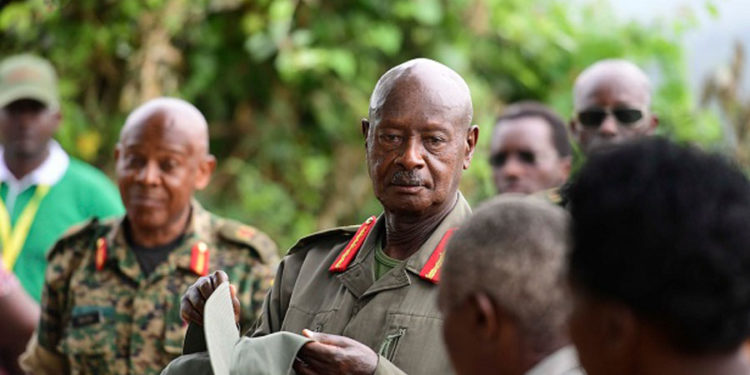 President Museveni talks to locals during a break