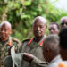 President Museveni talks to locals during a break