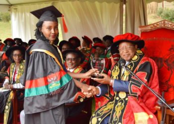 Prof. Ezra Suruma (Right) hands over the ACCA Uganda Award to Ms. Tumukunde Elizabeth, the best performing student in Bachelor of Commerce (Accounting Option) during the 2nd Session of the 69th Graduation Ceremony on 16th January 2019 at Makerere University, Kampala Uganda