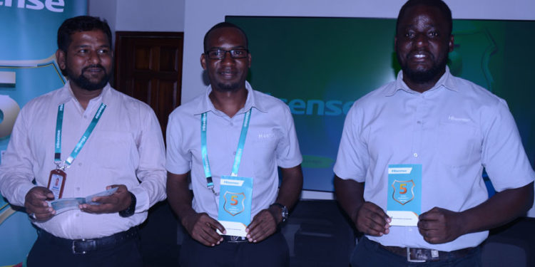 L-R: Mr Hisense Uganda Sales & Marketing Manager Moin Mohammed, Patrick Sande, Hisense Uganda Head Office Showroom Manager and Ivan Kakembo, the Assistant Marketing manager