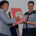 Education minister Janet Museveni (right) receives previous results from UNEB chairperson Mary Okwakol