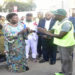 Kadaga (L) hands over a baton to one of the runners