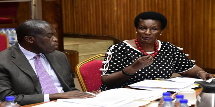 Amelia Kyambadde (R) with State Minister for Industry, Hon Michael Werikhe appearing before the Committee on Trade