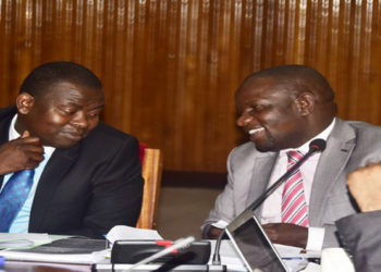 Cosase Vice Chair, Hon Kasozi(L) with Hon Paul Mwiru during the committee sitting