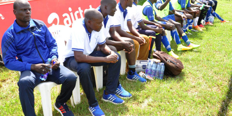 Steven Bogere and the late Jimmy Kisekka (Second-left) at Buddu technical bench recently. PHOTO BY BRIAN MUGENYI.