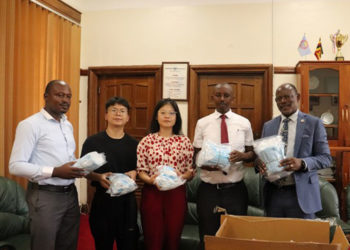 Prof Nawangwe handing over the surgical masks to Xiangtan University officials on Tuesday. PHOTO: Campus Bee
