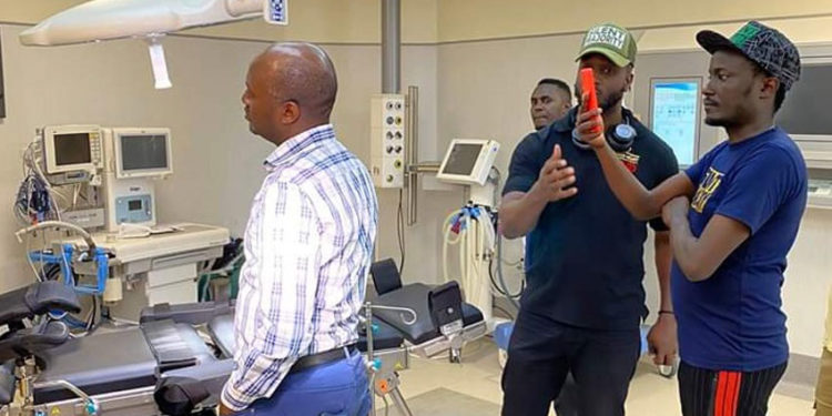 Bebe Cool and Andrew Mwenda inspecting Mulago Hospital a few days ago