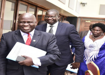 FDC's Wafula Oguttu(L) with the Party President, Hon Amuriat (C) after appearing before the Committee with LOP, Hon Aol Ocan