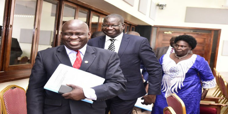 FDC's Wafula Oguttu(L) with the Party President, Hon Amuriat (C) after appearing before the Committee with LOP, Hon Aol Ocan