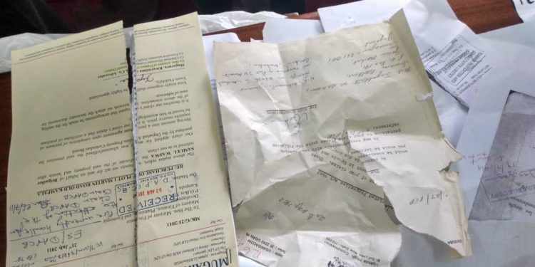 Some of the destroyed documents inside Mr Buzibu's office