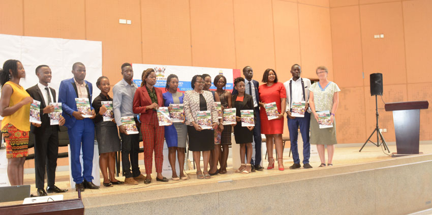 Students from various universities in Uganda with Associate Professor Consolata Kabonesa, the Principal Investigator Gender mainstreaming project at Makerere University on Thursday