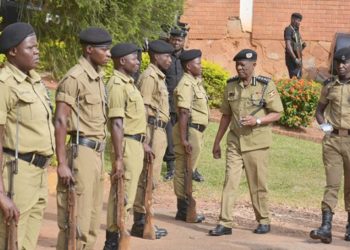 Police chief Ochola inspects a police parade