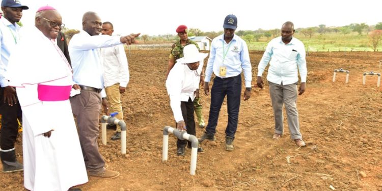 President Museveni commissions Aringo Omone Small Scale Irrigation system in Pader districs as Archbishop Odama (L) looks on. Saturday March 7, 2020. PPU Photo