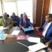 Prof. Vinand Mukatabala Nantulya (Left) handing over the petition to Hon. Frank Tumwebaze in Kampala.