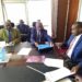 Prof. Vinand Mukatabala Nantulya (Left) handing over the petition to Hon. Frank Tumwebaze in Kampala.