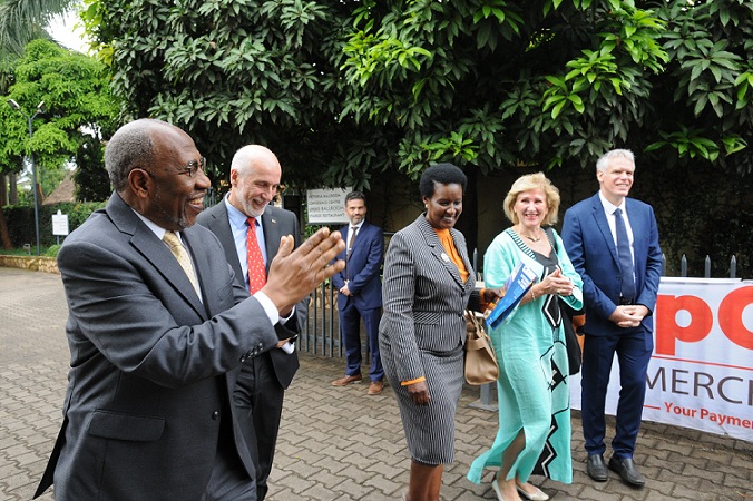 Prime Minister Rugunda arrives for the Uganda-Europe Business Forum on Monday. He was welcomed by by H.E. Attilio Pacifici, the Ambassador of the EU to Uganda (2L) and Trade minister Amelia Kyambadde