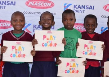 Pupils at Kiswa Primary School display the newly launched colour books