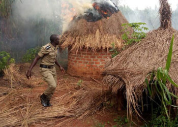 A police officer at the shrine of a traditional healer