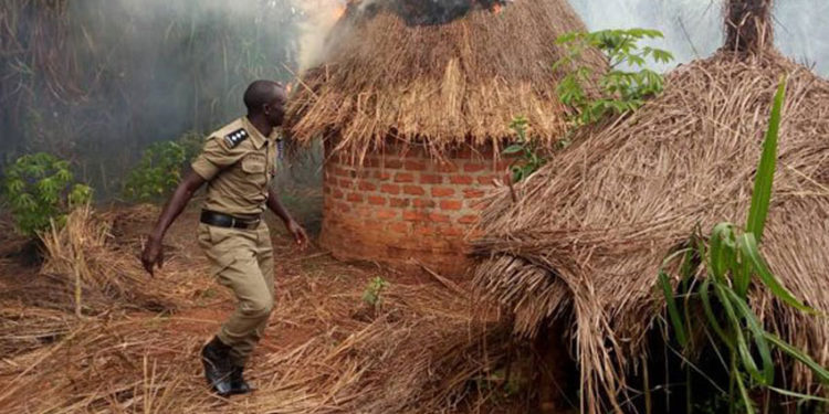 A police officer at the shrine of a traditional healer