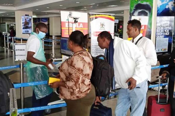 Travellers undergo health checks at the Entebbe International Airport on February 6, 2020