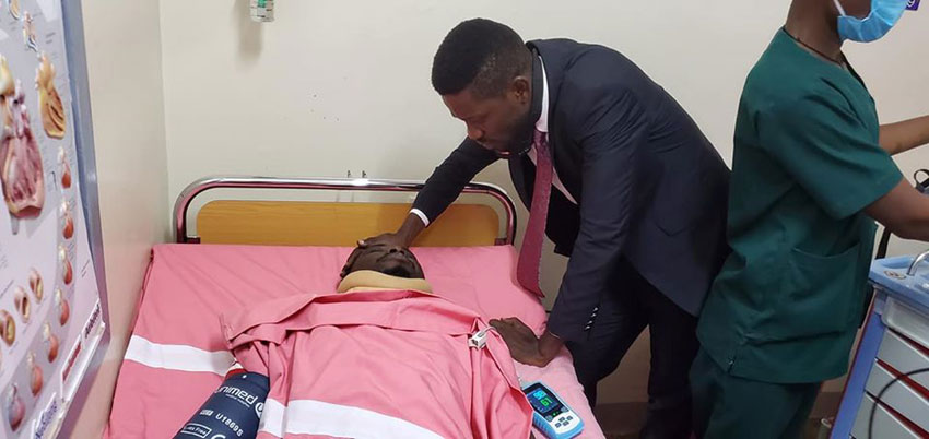 Bobi Wine visiting his ailing colleague Francis Zaake at Rubaga Hospital on Wednesday