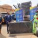 Health Minister Dr. Jane Ruth Aceng receives the donations from Housing Finance Bank Managing Director Micheal K. Mugabi and Executive Director Peace Kabunga