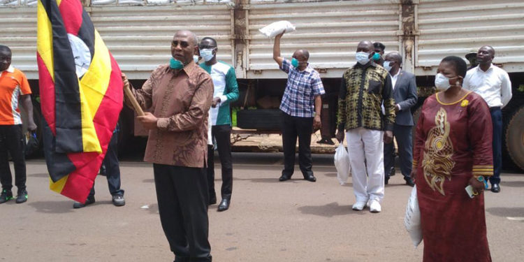 PM Rugunda flagging off food distribution in Kampala recently