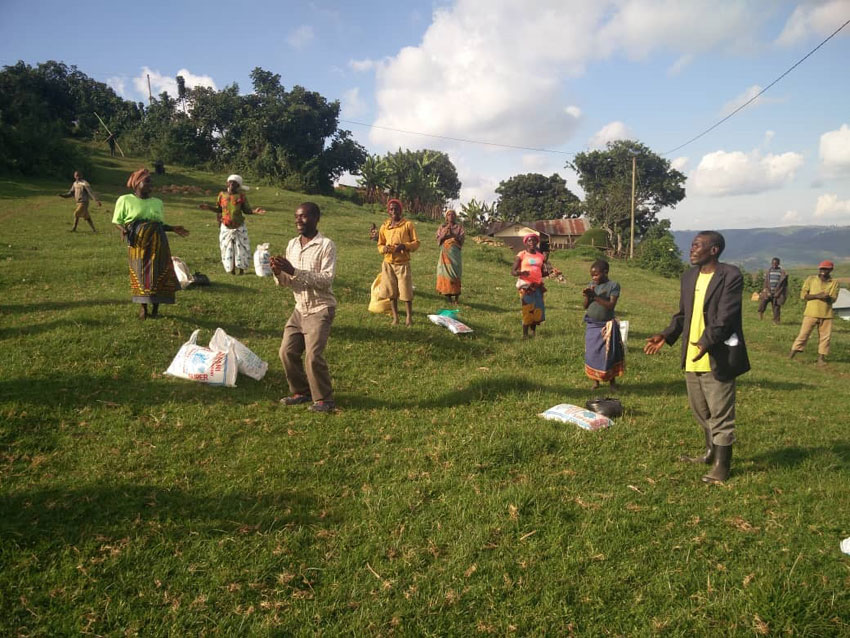 Batwa dancing after receiving food