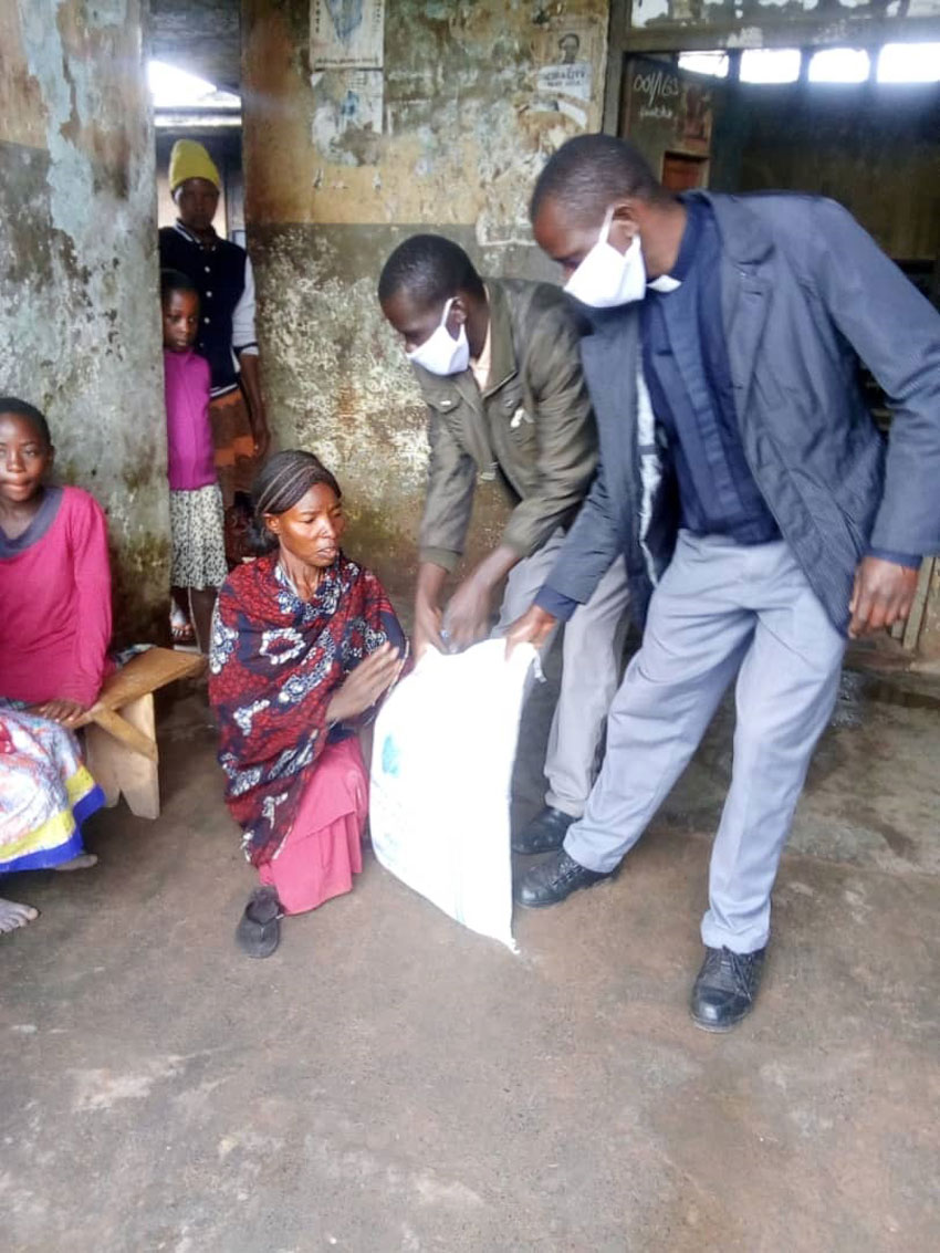 Disabled mother receiving maize flour