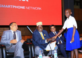 Gen. Moses Ali greets a pupil from one of Airtel's adopted schools during the launch of Airtel countrywide 4G