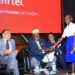 Gen. Moses Ali greets a pupil from one of Airtel's adopted schools during the launch of Airtel countrywide 4G