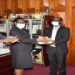 Clerk to Parliament, Ms Jane Kibirige (2nd L) handsover Shs30 million to Dr. Samuel Guma, the Executive Director at New Hope Children’s Hostel. (Left) is the Deputy Clerk to Parliament, Mr. Henry Waiswa (left) and (right) is Henrieta Kebirungi, Resource Mobiliser of New Hope Children’s Hostel