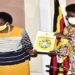 Minister Mary Karooro Okurut (left) hands over the SDGs report to the Speaker of Parliament Kadaga