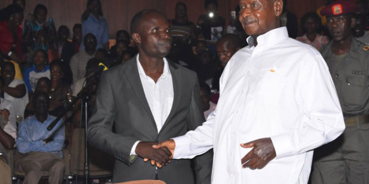 Ronald Mayinja with President Yoweri Museveni in 2019