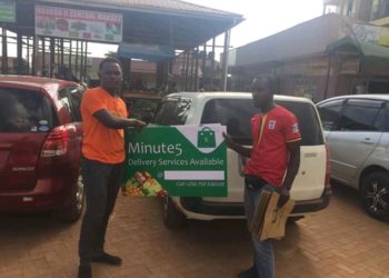 A minute 5 Executive in a photo moment with a new supplier as part of their ongoing expansion drive around Kampala Markets