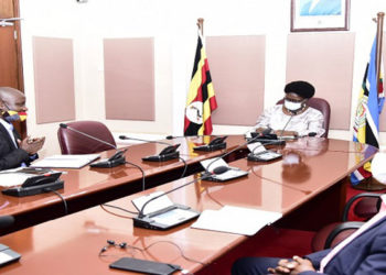 Speaker Kadaga(C) meets representatives of the rural broadcasters