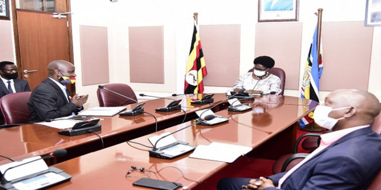 Speaker Kadaga(C) meets representatives of the rural broadcasters