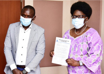 Speaker Kadaga receiving the petition from Abdu Karim Mucunguzi, the association's chairperson.