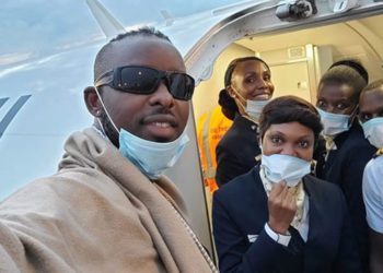 Eddy Kenzo with Uganda Airlines cabin crew on Friday