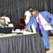 Mwiru(R) lays the bill on table after it's First Reading
