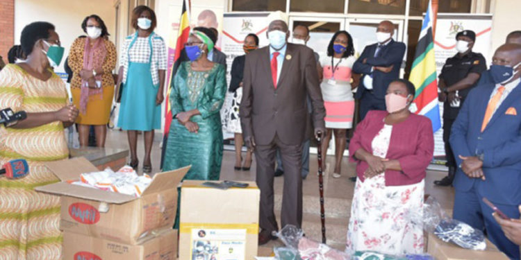 Moses Ali, the First Deputy Prime Minister(C) flags off a consignment of face masks that were to be distributed in some parts of the country on June 11