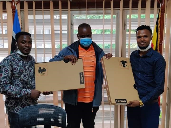 Bloggers Ashburg Katto, Ray Supasta recieving laptops to do NRM social media works days after defecting to ruling party