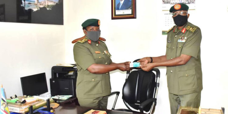 Brig Richard Karemire handing over office to Brig Flavia Byekwaso